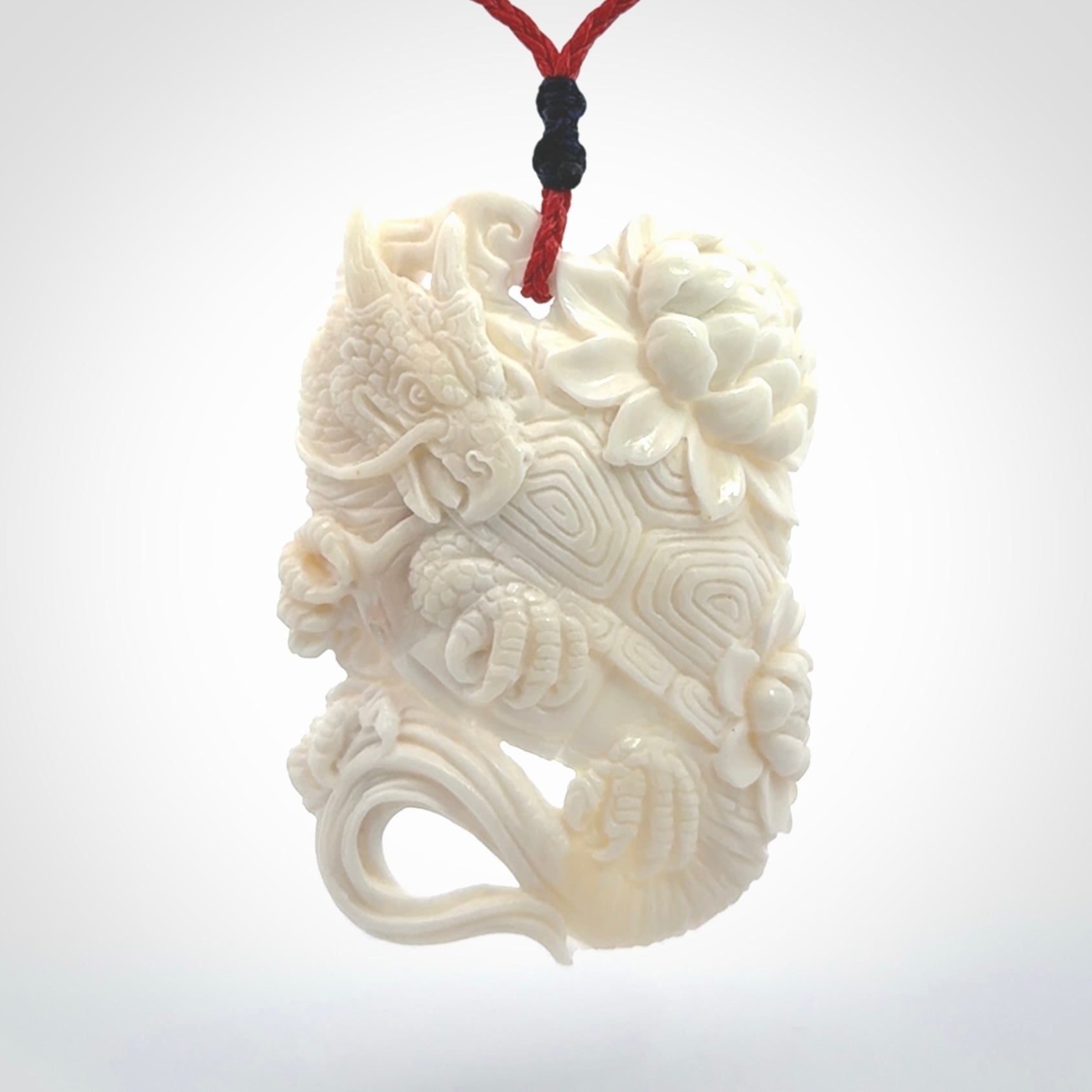 Hand Carved Bone dragon hatchling pendant