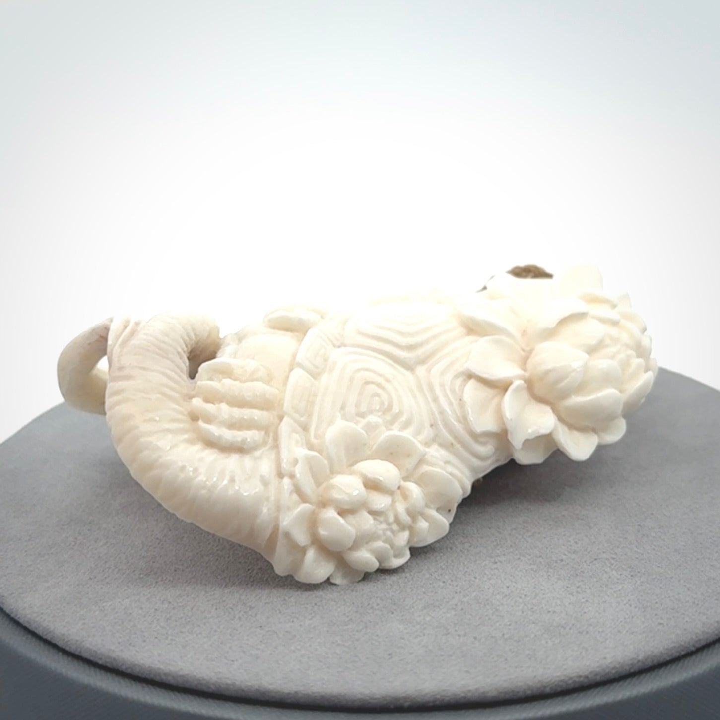 This is a hand carved bone baby dragon pendant. It is made from bone and has an adjustable tan coloured cord. This is a large sized necklace and is a very unique, one only, pendant that is a piece for art lovers.