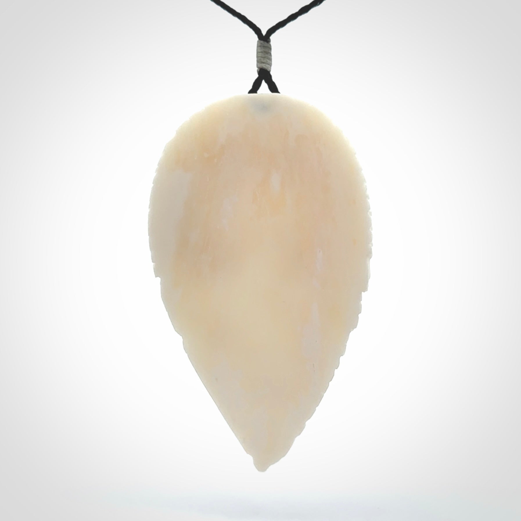 A Owl design carving, hand made for us from Bone. This pendant is provided with an adjustable black cord.