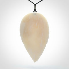 A Owl design carving, hand made for us from Bone. This pendant is provided with an adjustable black cord.
