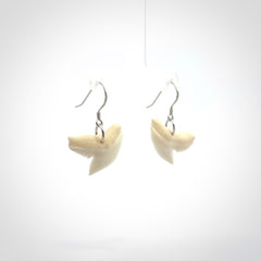 Hand carved small sized Tiger shark tooth earrings. Hand made shark tooth earrings. Real shark tooth art to wear. Free Shipping worldwide. Packaged in a woven kete pouch.