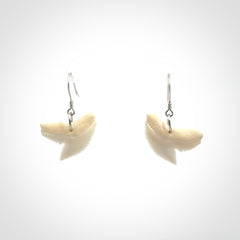 Hand carved small sized Tiger shark tooth earrings. Hand made shark tooth earrings. Real shark tooth art to wear. Free Shipping worldwide. Packaged in a woven kete pouch.