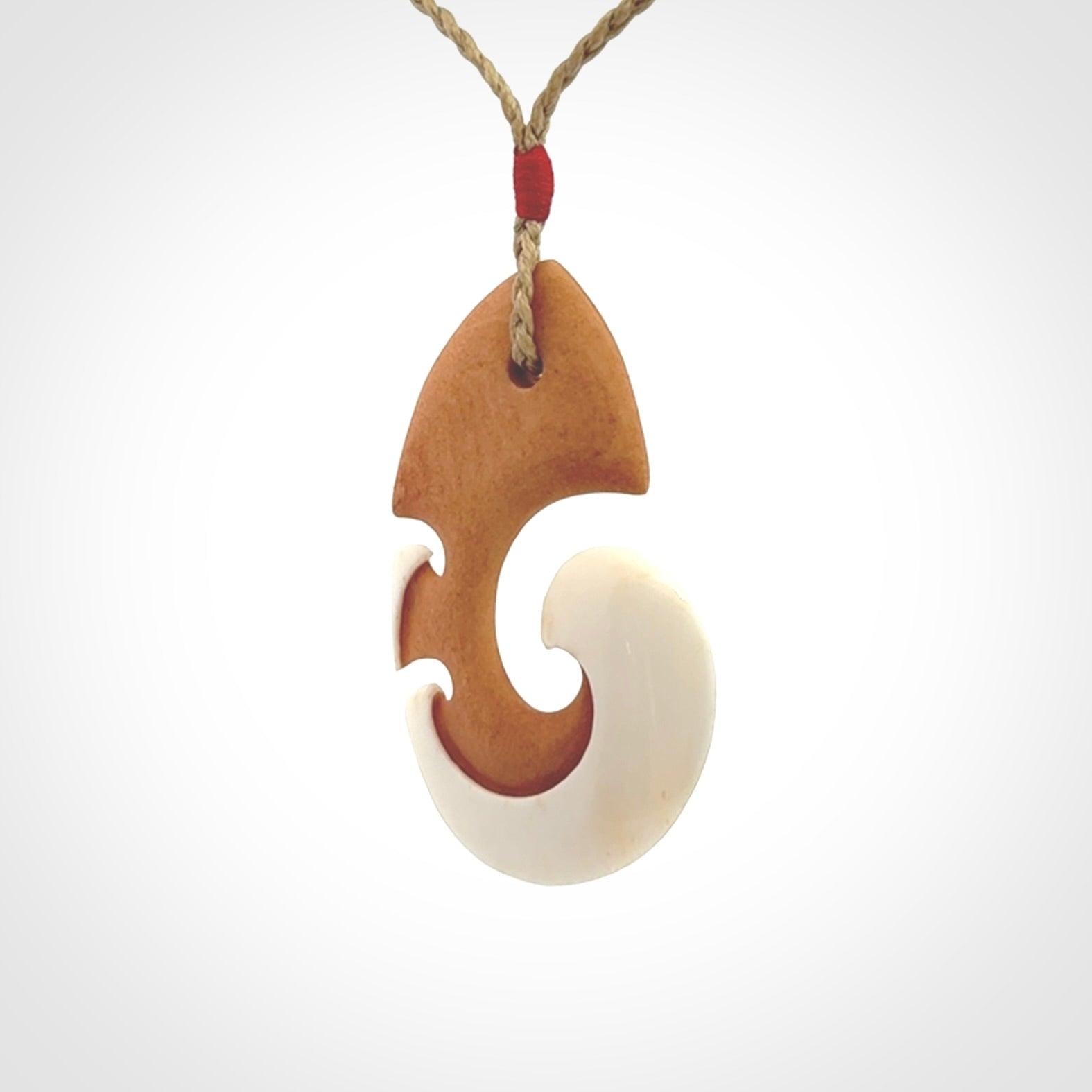 Beautifully Balanced and Detailed koru pendant, carved in bone