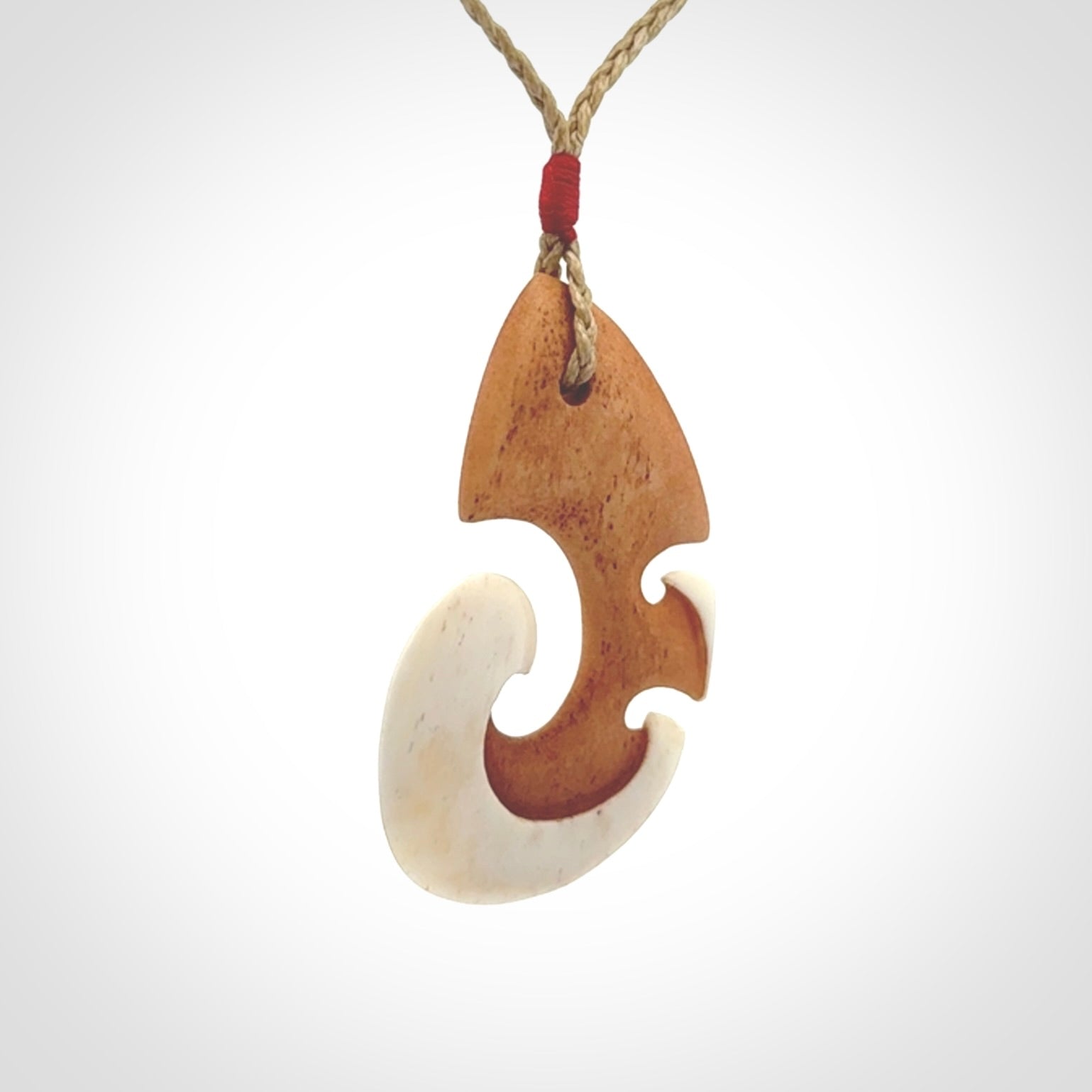 Beautifully Balanced and Detailed koru pendant, carved in bone