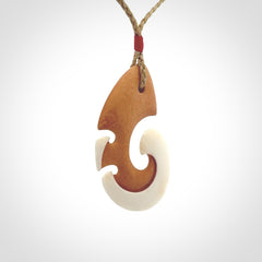 Beautifully Balanced and Detailed koru pendant, carved in bone