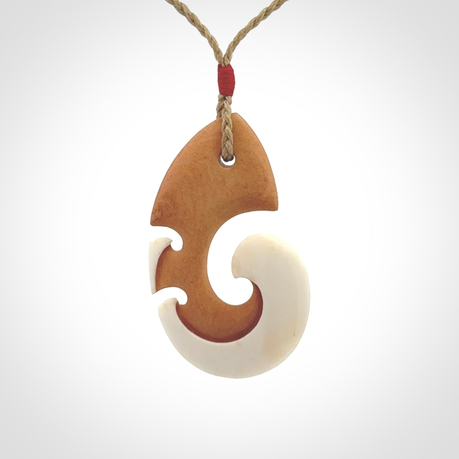 Beautifully Balanced and Detailed koru pendant, carved in bone