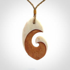 Hand carved bone hook pendant