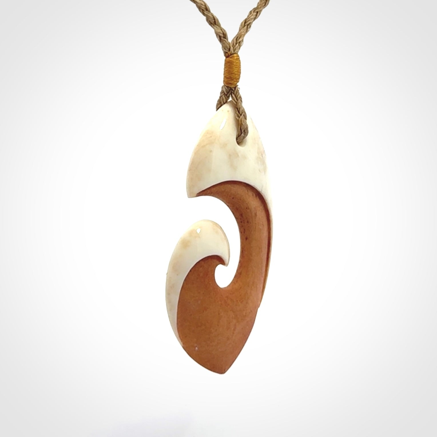 Hand carved bone hook pendant