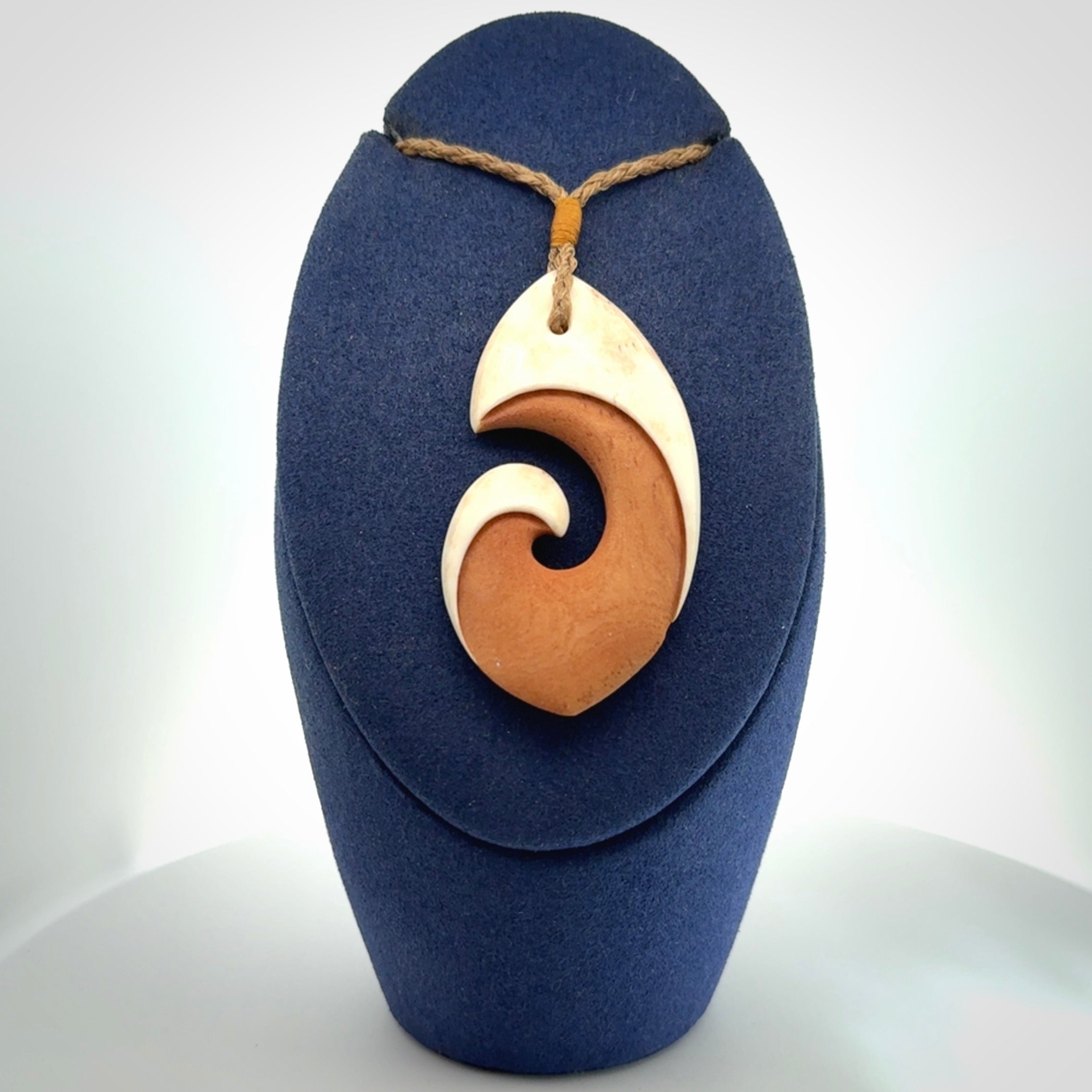 Hand carved bone hook pendant