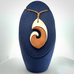 Hand carved bone hook pendant