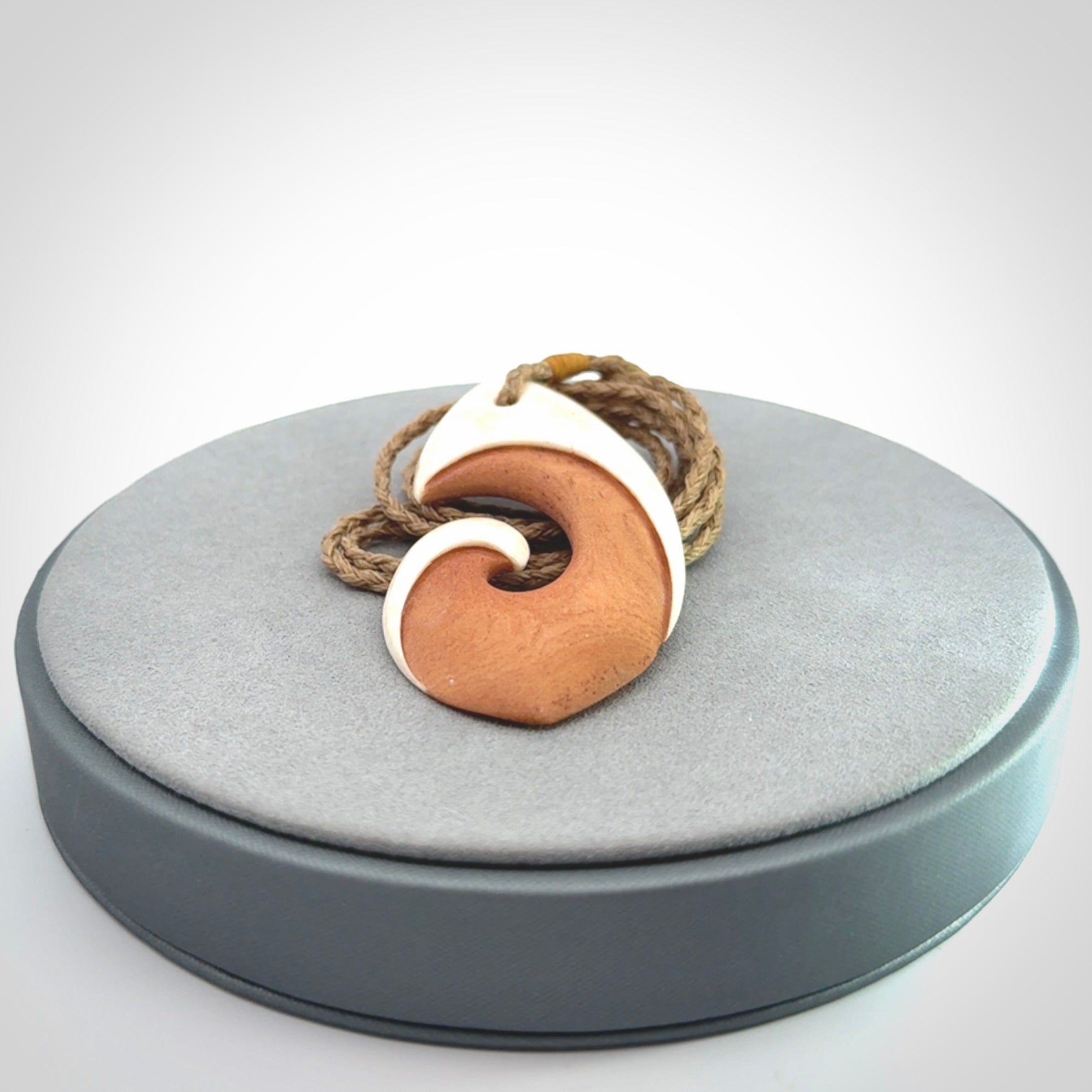 Hand carved bone hook pendant