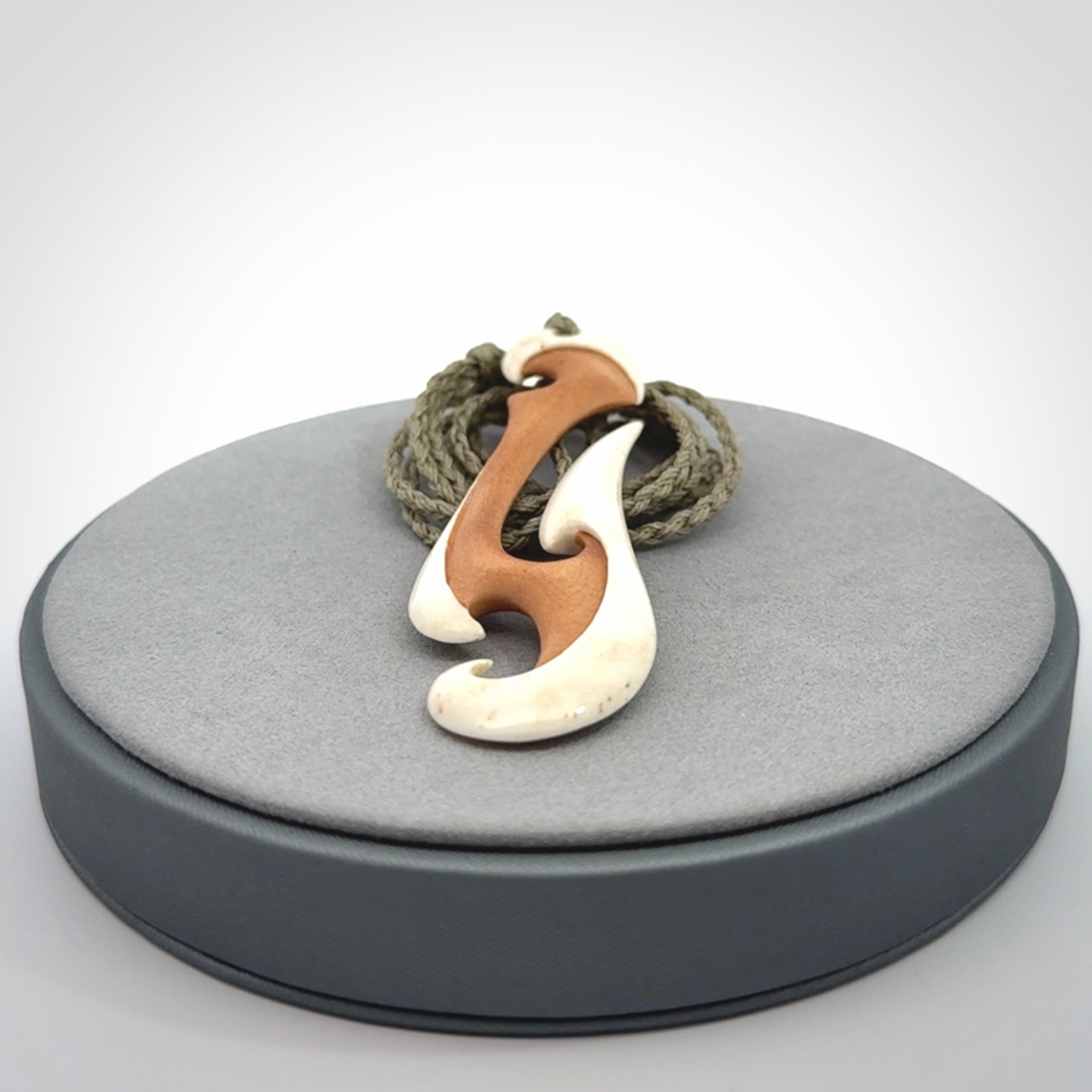 Hand carved bone hook pendant