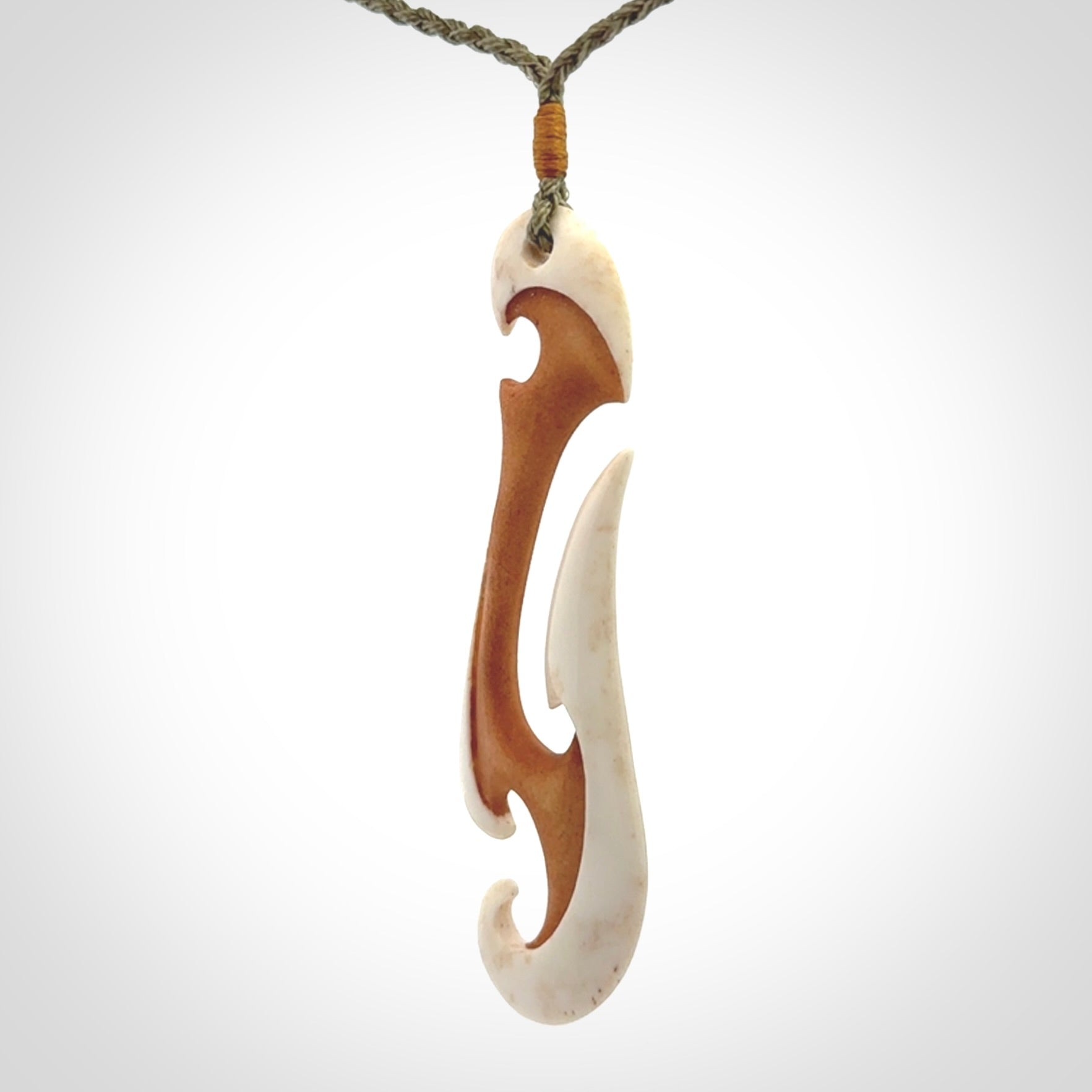Hand carved bone hook pendant