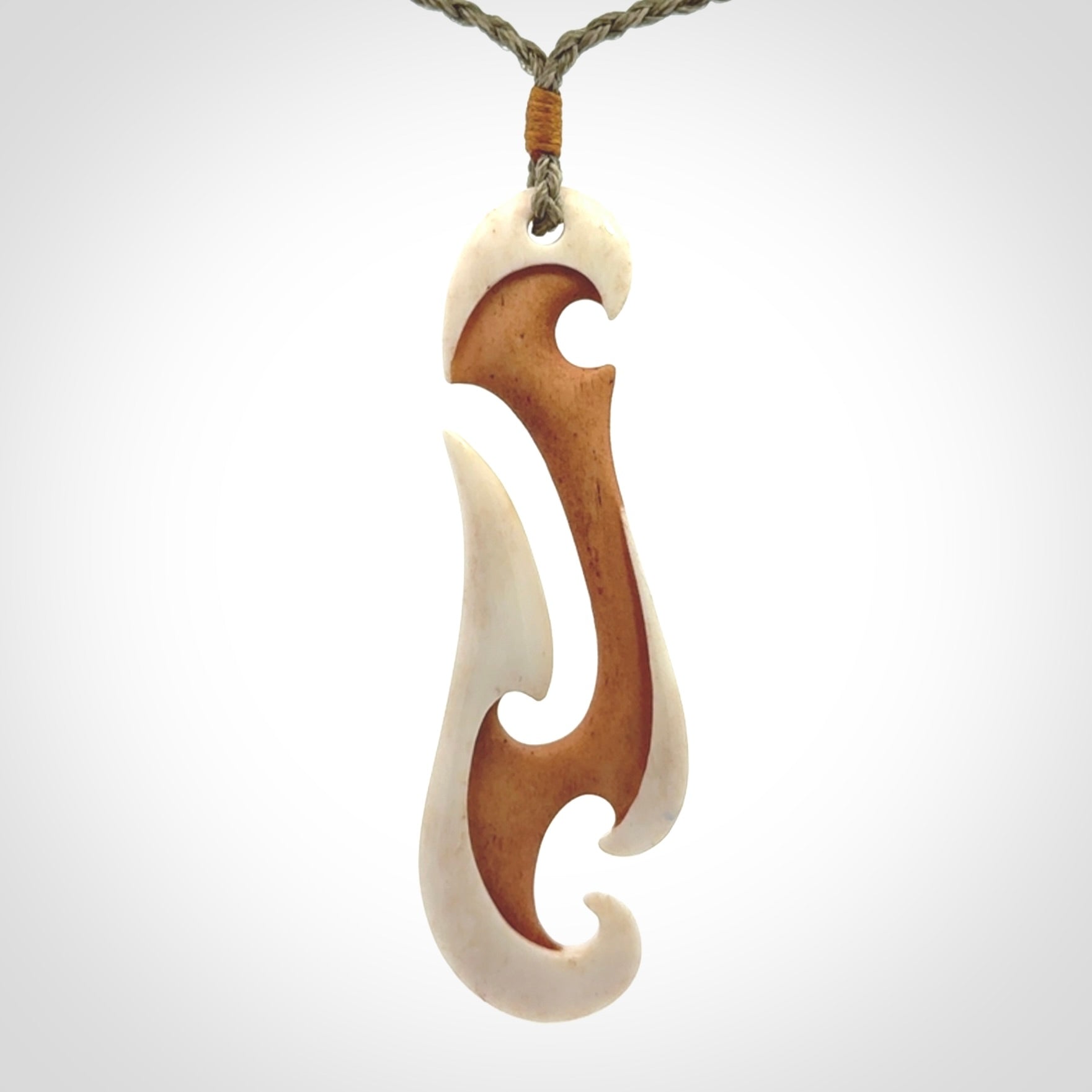 Hand carved bone hook pendant