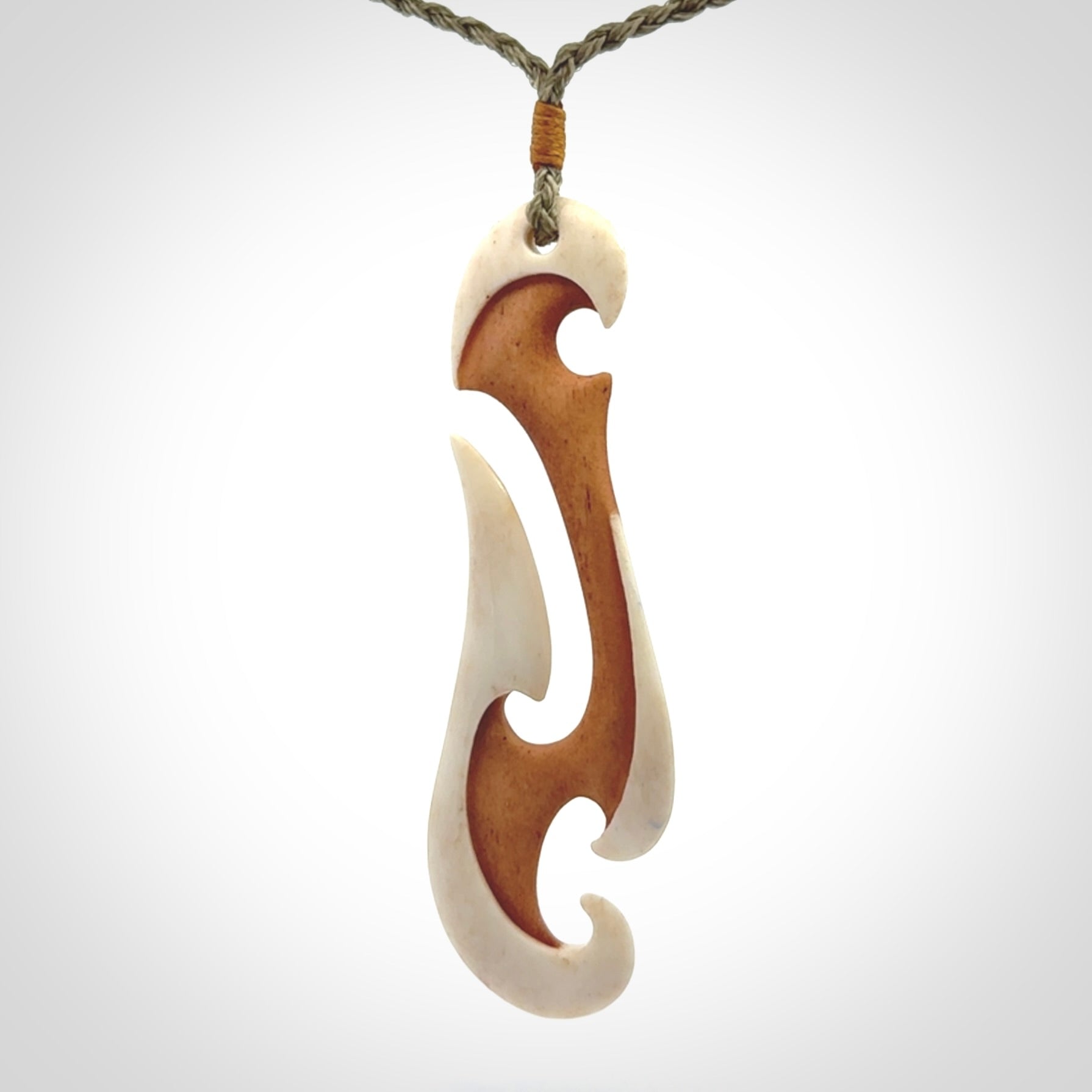 Hand carved bone hook pendant