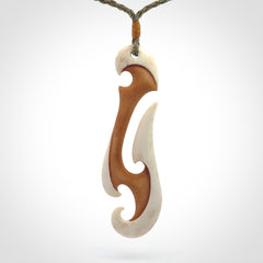 Hand carved bone hook pendant
