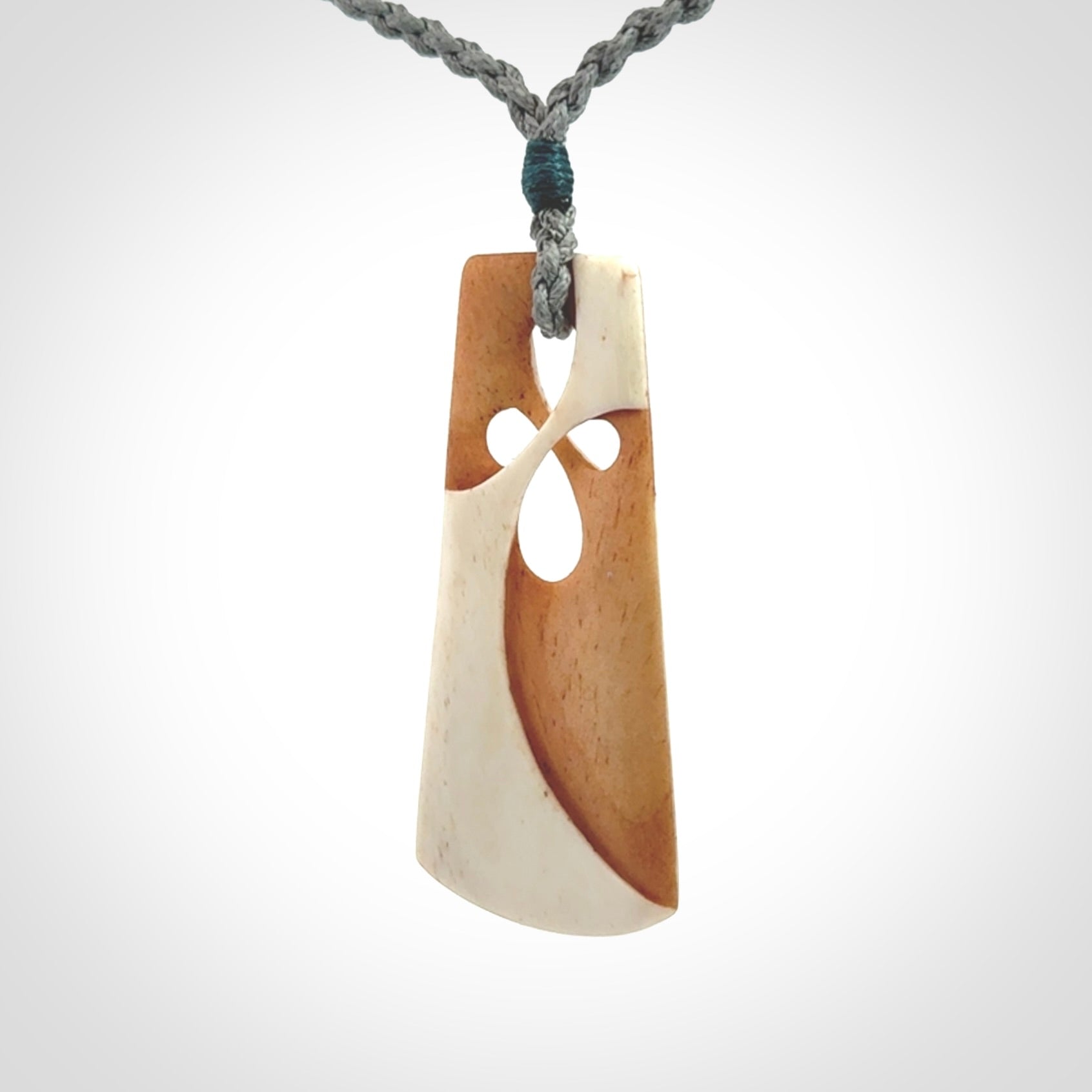 Hand carved bone path of life toki pendant