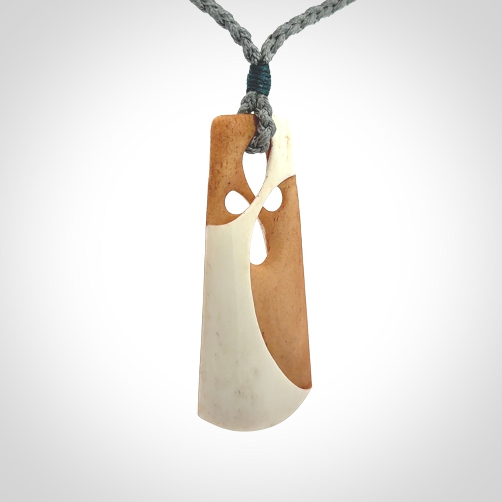 Hand carved bone path of life toki pendant