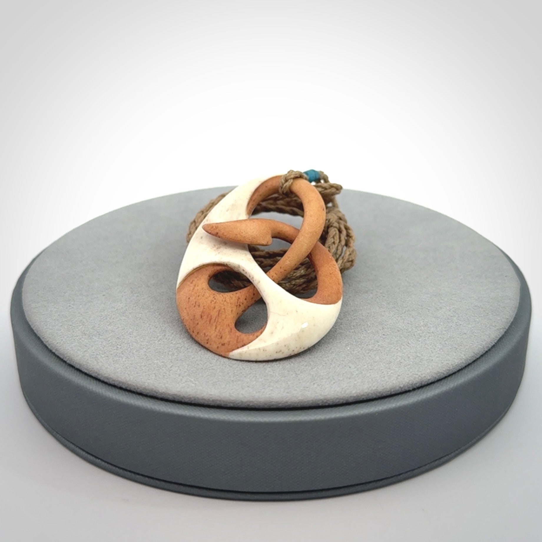Hand carved bone path of life hook pendant