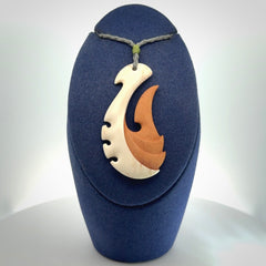 Hand carved bone hook pendant