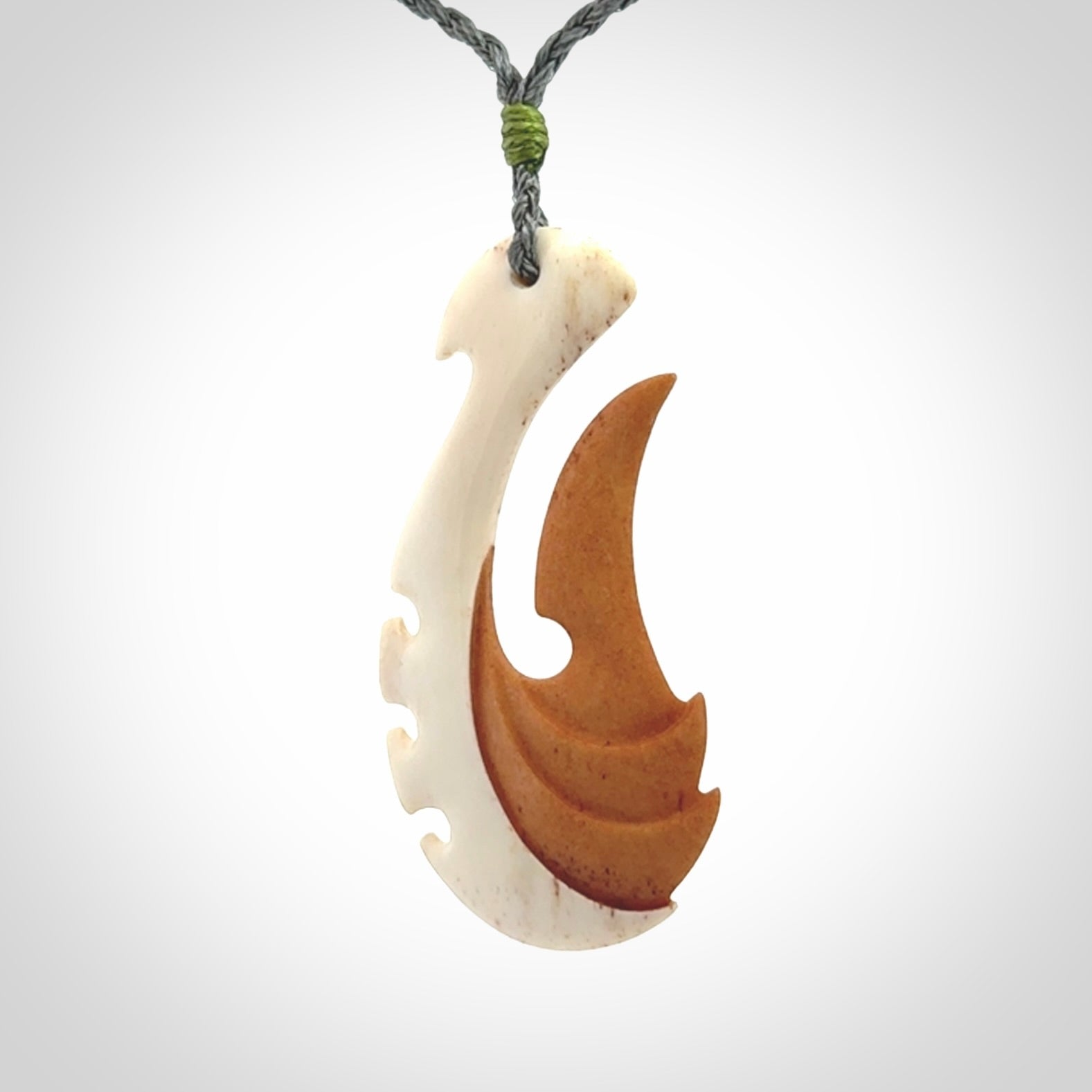Hand carved bone hook pendant