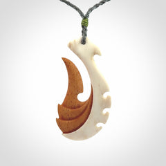 Hand carved bone hook pendant