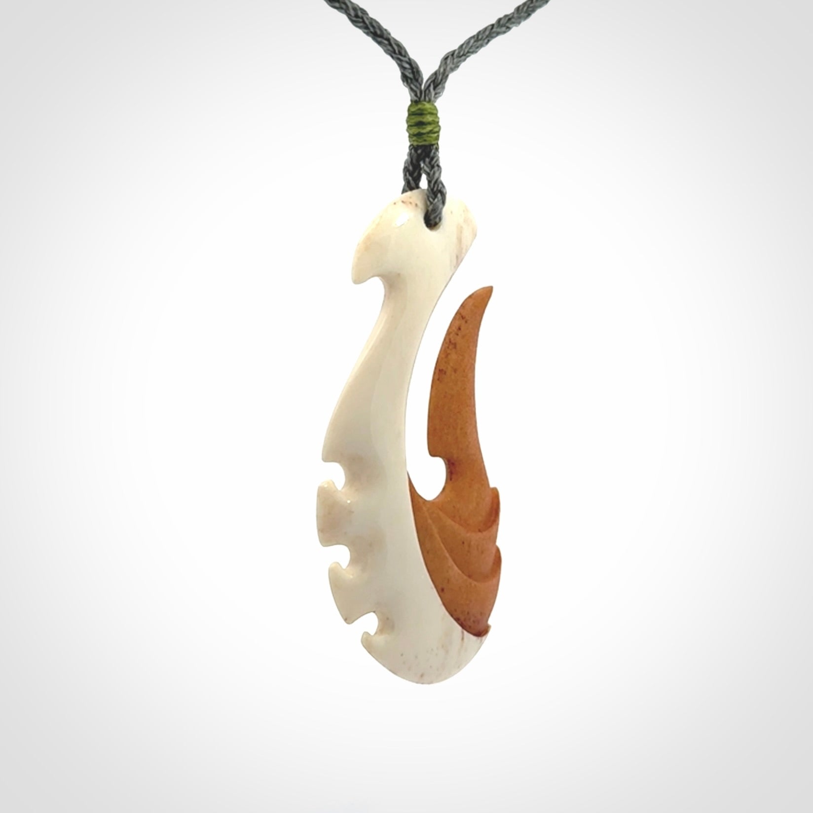 Hand carved bone hook pendant