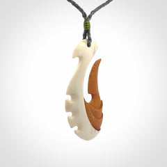 Hand carved bone hook pendant