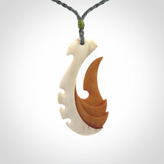 Hand carved bone hook pendant