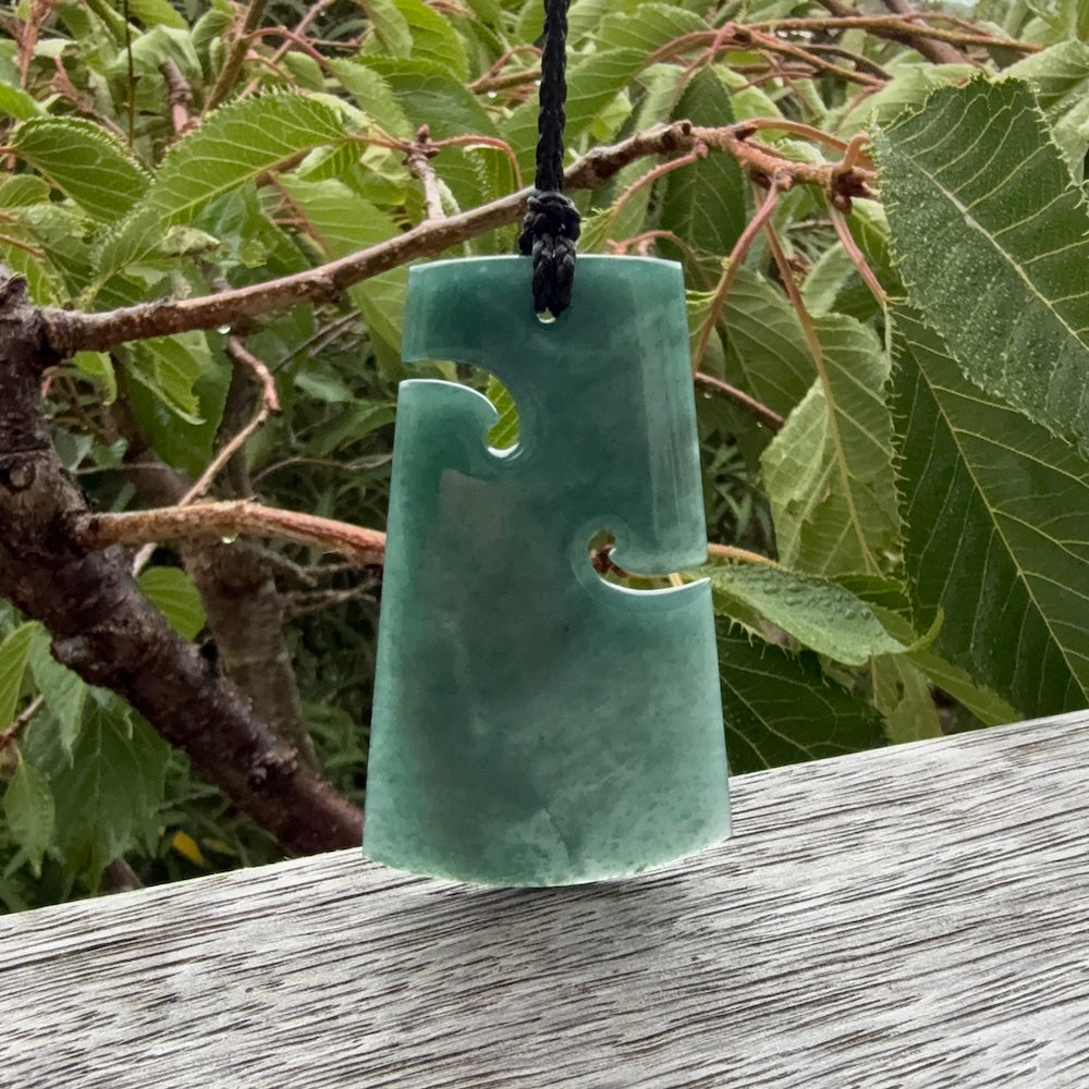 Hand carved large Guatemalan Jadeite Toki pendant.