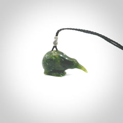 Hand carved Jade kiwi pendant for lovers of birds. Hand made kiwi necklace with black adjustable cord. Unique gifts and Art to Wear by NZ Pacific.