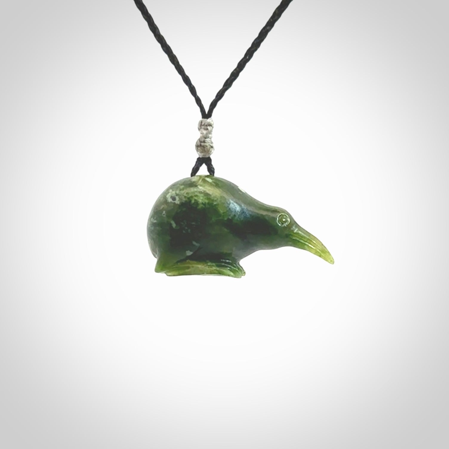 Hand carved Jade kiwi pendant for lovers of birds. Hand made kiwi necklace with black adjustable cord. Unique gifts and Art to Wear by NZ Pacific.