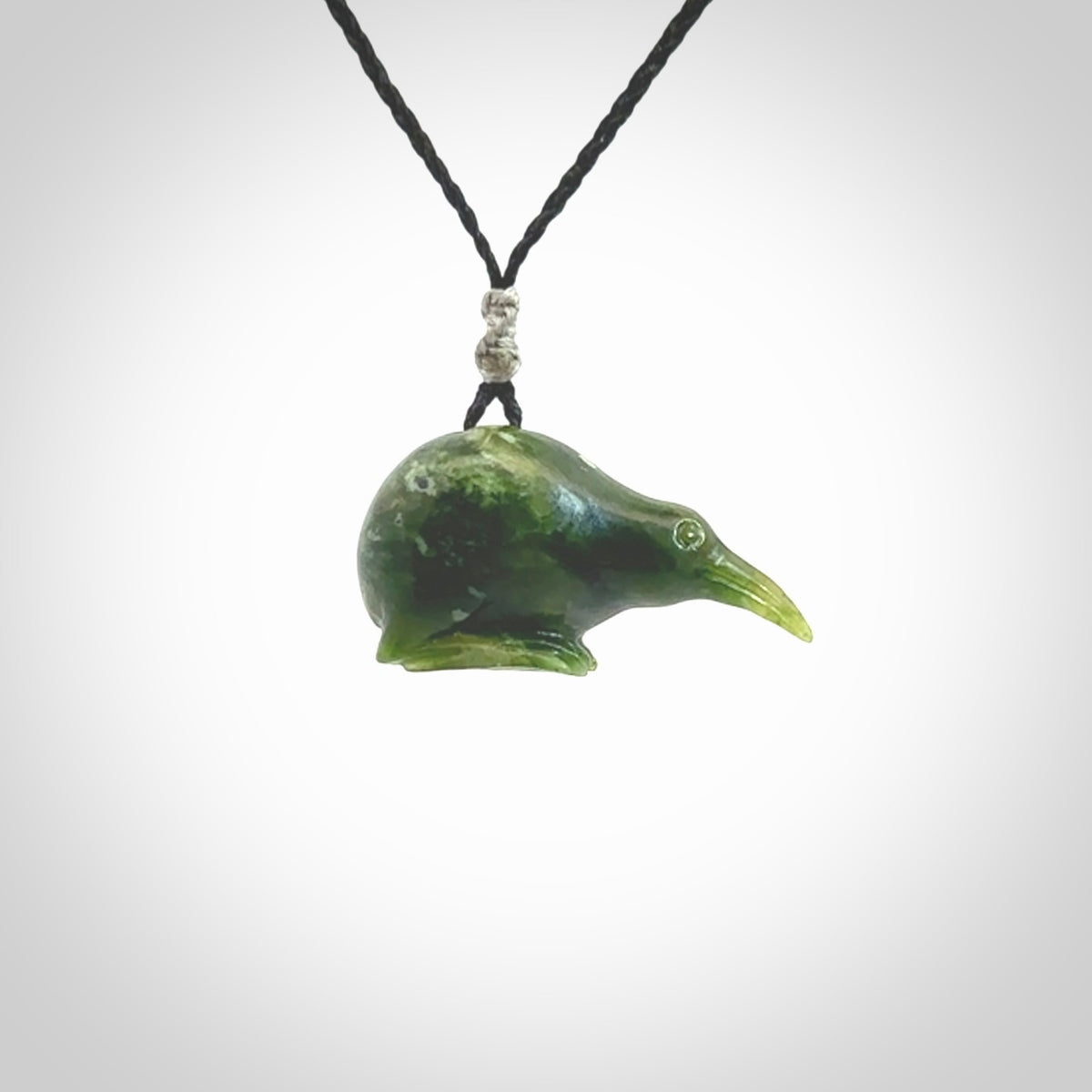 Hand carved Jade kiwi pendant for lovers of birds. Hand made kiwi necklace with black adjustable cord. Unique gifts and Art to Wear by NZ Pacific.