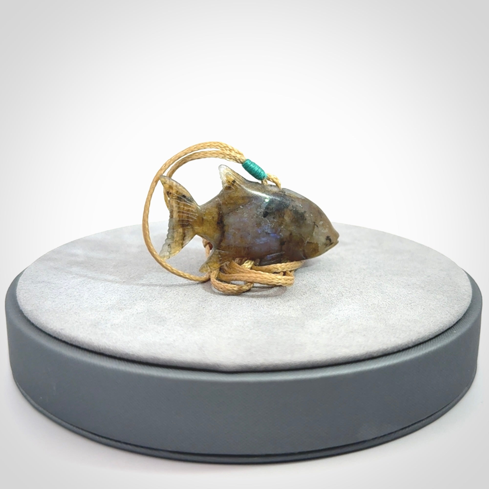Hand carved Labradorite Trevally fish pendants.