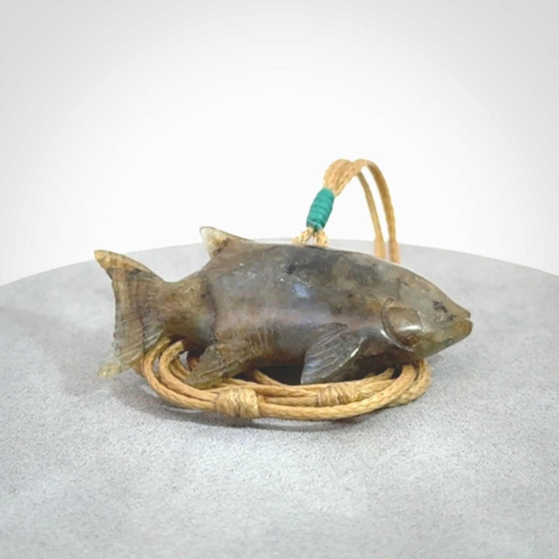 Hand carved Labradorite Trevally fish pendants.