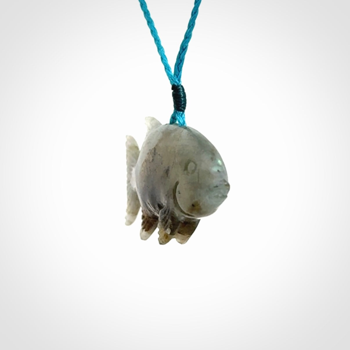 Hand carved Labradorite Trevally fish pendants.