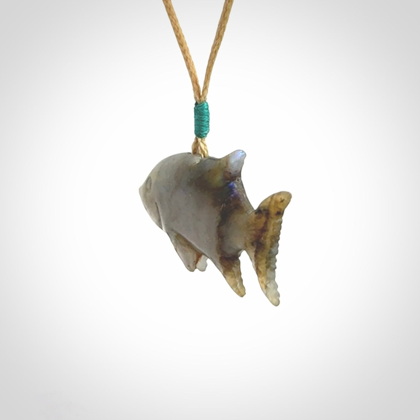 Hand carved Labradorite Trevally fish pendants.