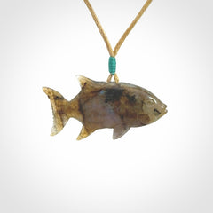 Hand carved Labradorite Trevally fish pendants.