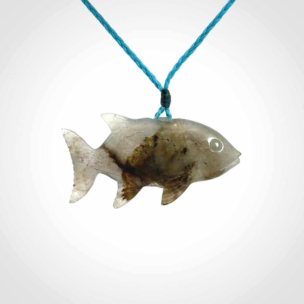 Hand carved Labradorite Trevally fish pendants.