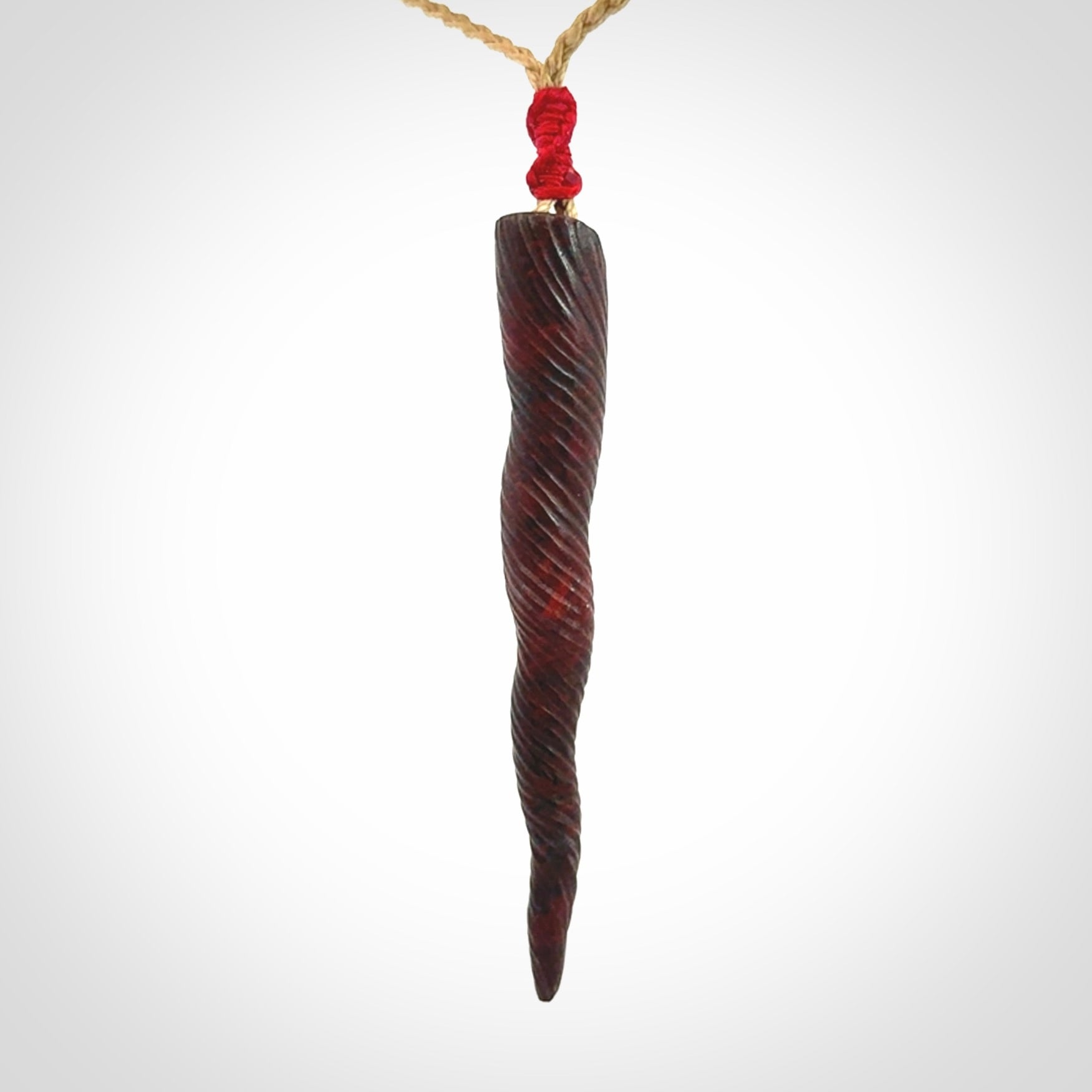 A Unicorn Horn pendant Carved in Jasper