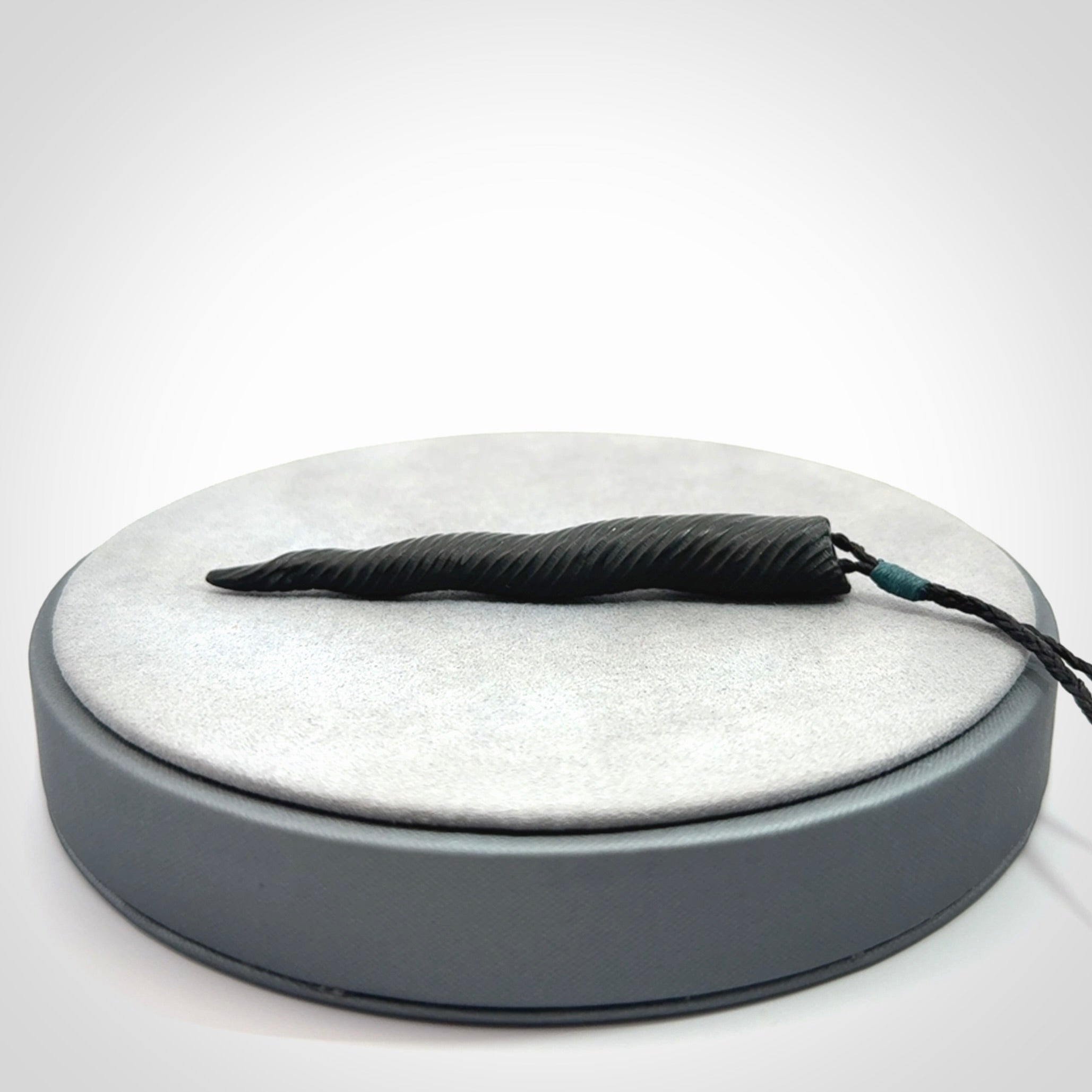 A Wonderful Unicorn Horn Pendant, Carved in Black Jade