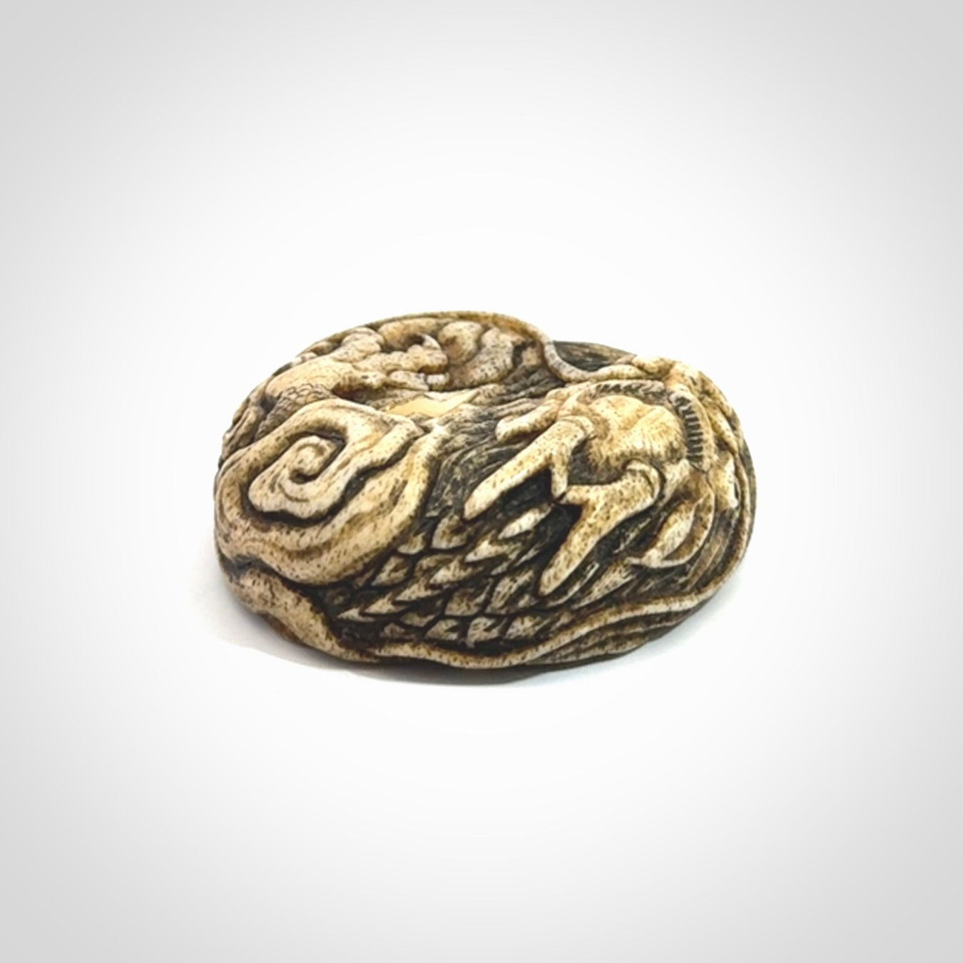 Hand carved red eyed dragon in the clouds made from Deer antler Crown with Mother of Pearl and Gold Leaf. Hand made by master bone carver Fumio Noguchi. Spectacular collectable work of art to display. One only, delivered to you at no extra cost with express courier.