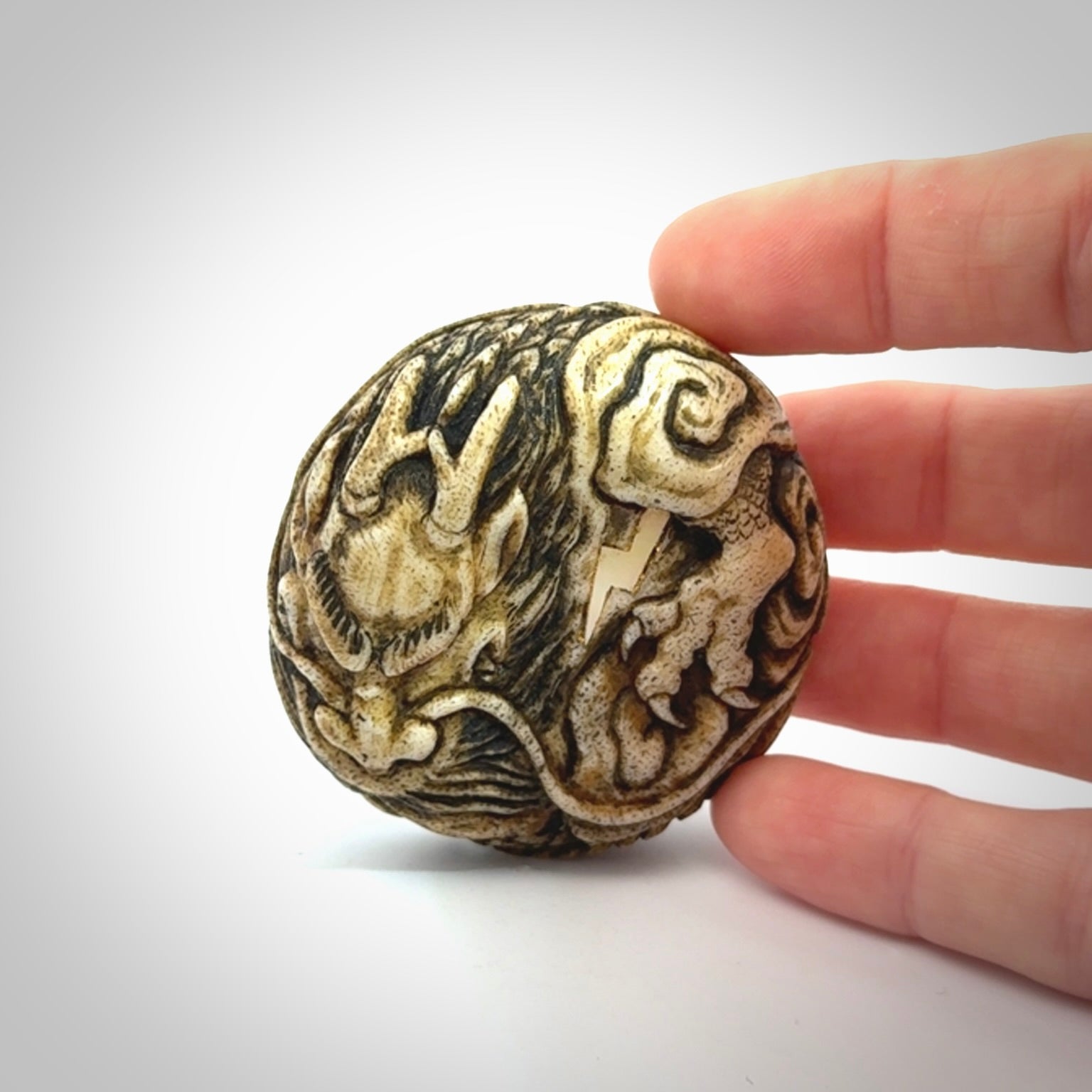 Hand carved red eyed dragon in the clouds made from Deer antler Crown with Mother of Pearl and Gold Leaf. Hand made by master bone carver Fumio Noguchi. Spectacular collectable work of art to display. One only, delivered to you at no extra cost with express courier.