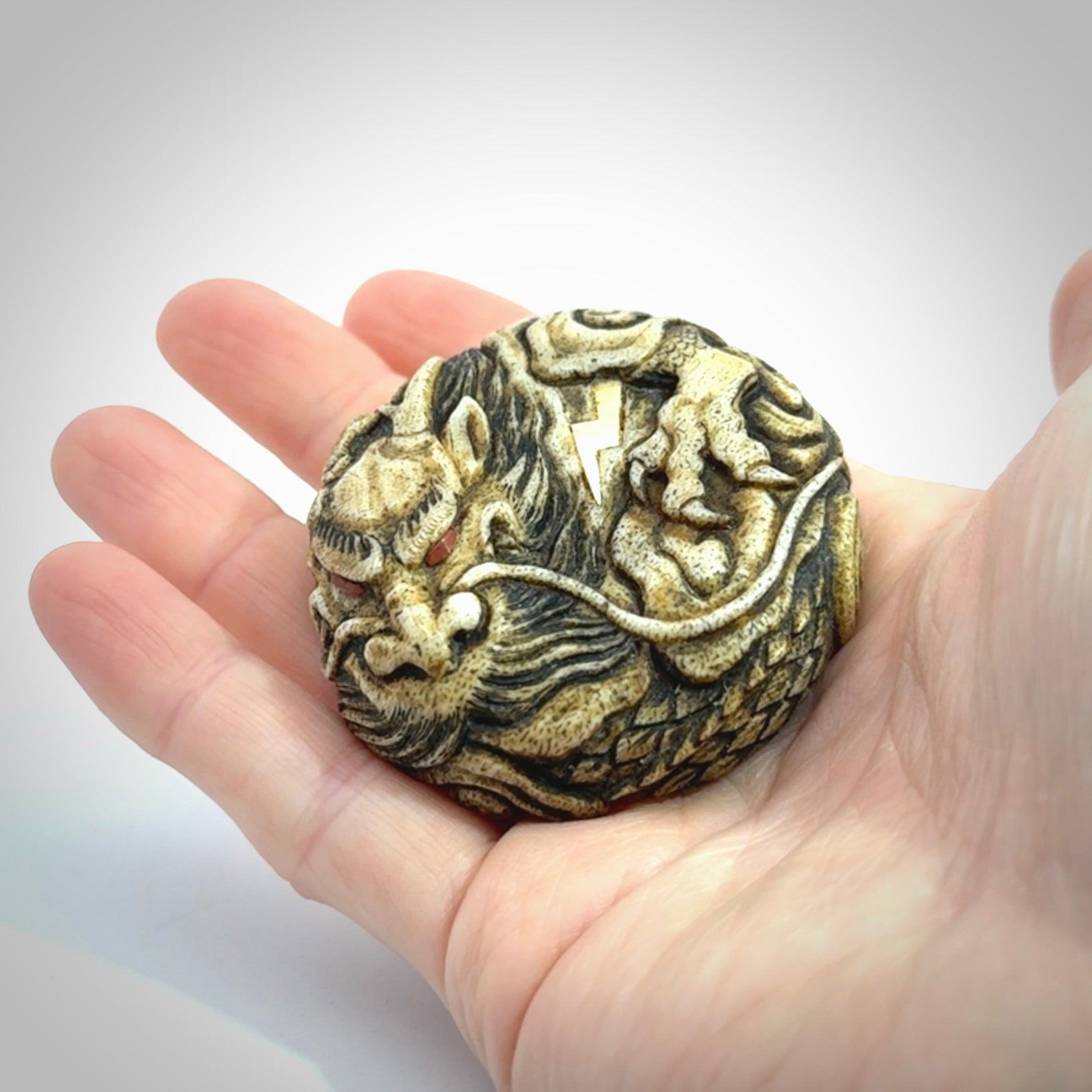 Hand carved red eyed dragon in the clouds made from Deer antler Crown with Mother of Pearl and Gold Leaf. Hand made by master bone carver Fumio Noguchi. Spectacular collectable work of art to display. One only, delivered to you at no extra cost with express courier.