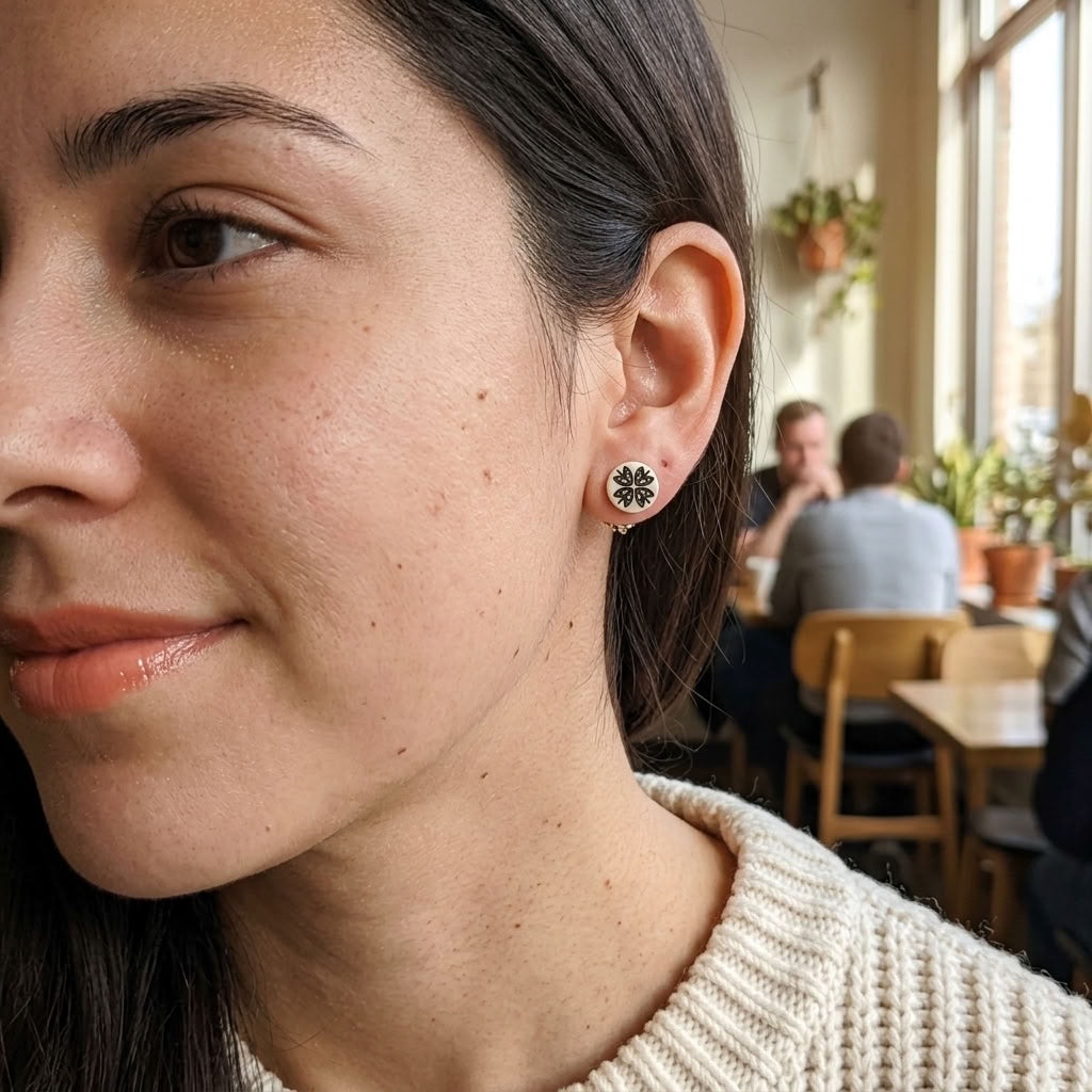 Woman wearing bone stud earrings