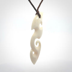 This is a wonderful, contemporary large koru from bone. Hand carved and provided with an adjustable brown cord.