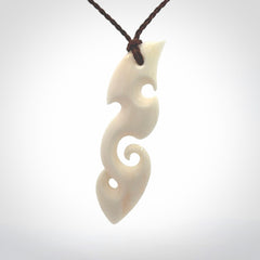 This is a wonderful, contemporary large koru from bone. Hand carved and provided with an adjustable brown cord.