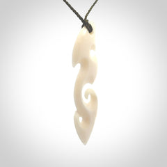 This is a wonderful, contemporary large koru from bone. Hand carved and provided with an adjustable olive cord.