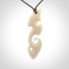 This is a wonderful, contemporary large koru from bone. Hand carved and provided with an adjustable olive cord.