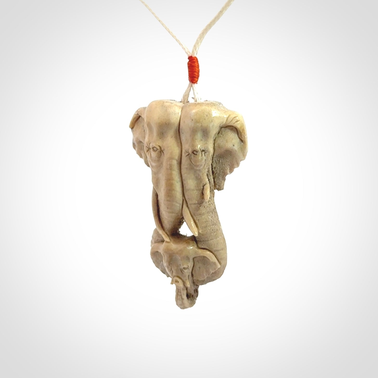 This is a triple elephant pendant, carved in a Deer Antler. The cord is length adjustable. Provided in a woven kete pouch and delivered with express courier.